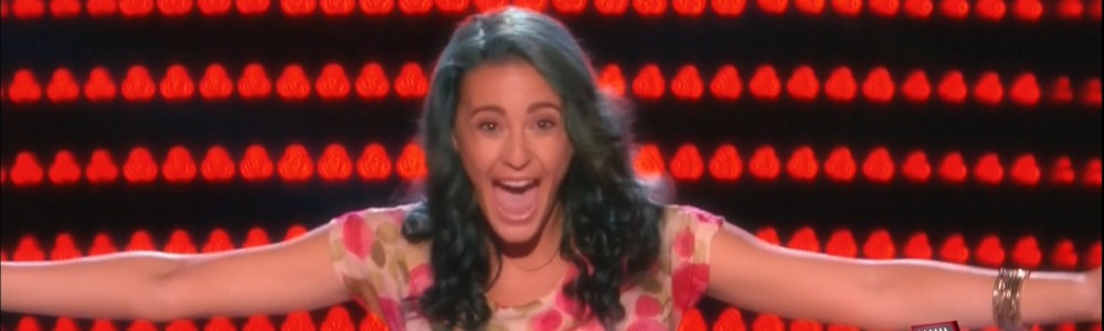 The Voice contestant reacts in the best way possible, by giving the entire world a big hug.